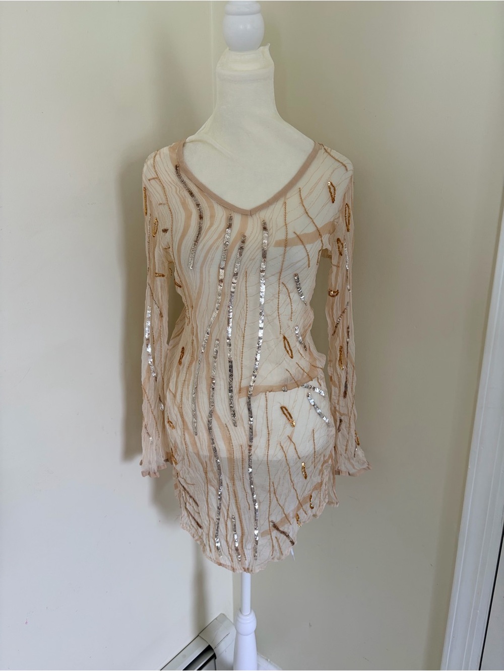 Vintage Y2K GOA sheath dress features a nude mesh fabric adorned with vertical r